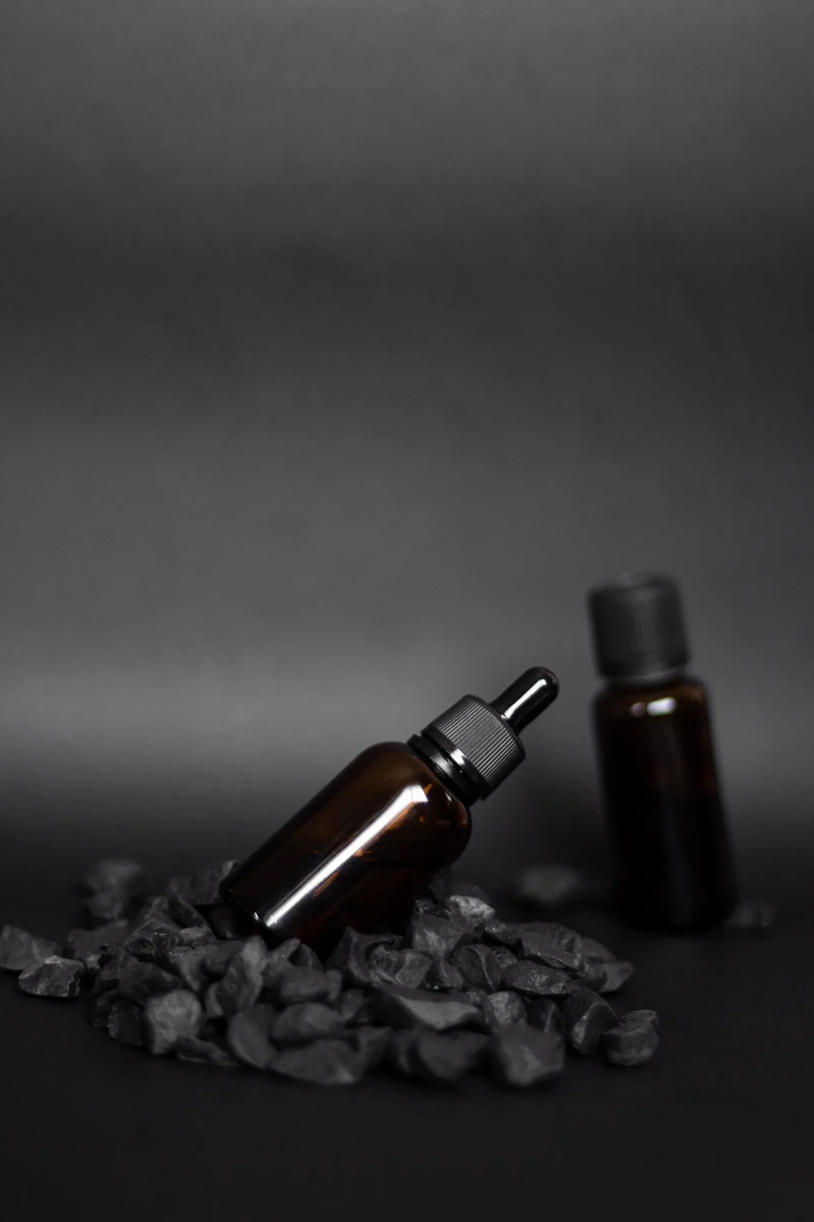 Crown & Collar apothecary bottles on a dark set